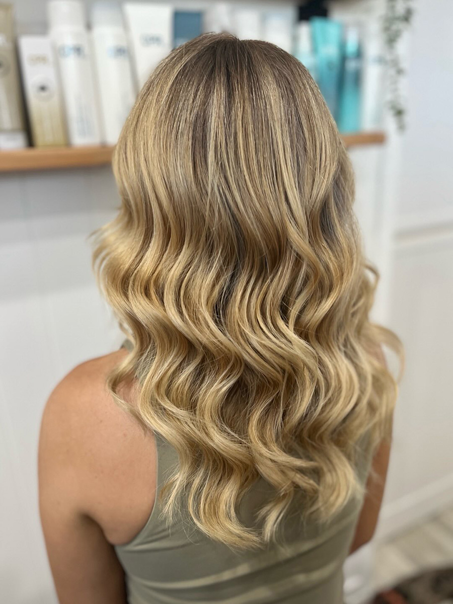 Soft blonde waves by Salt and Strands Hair Studio