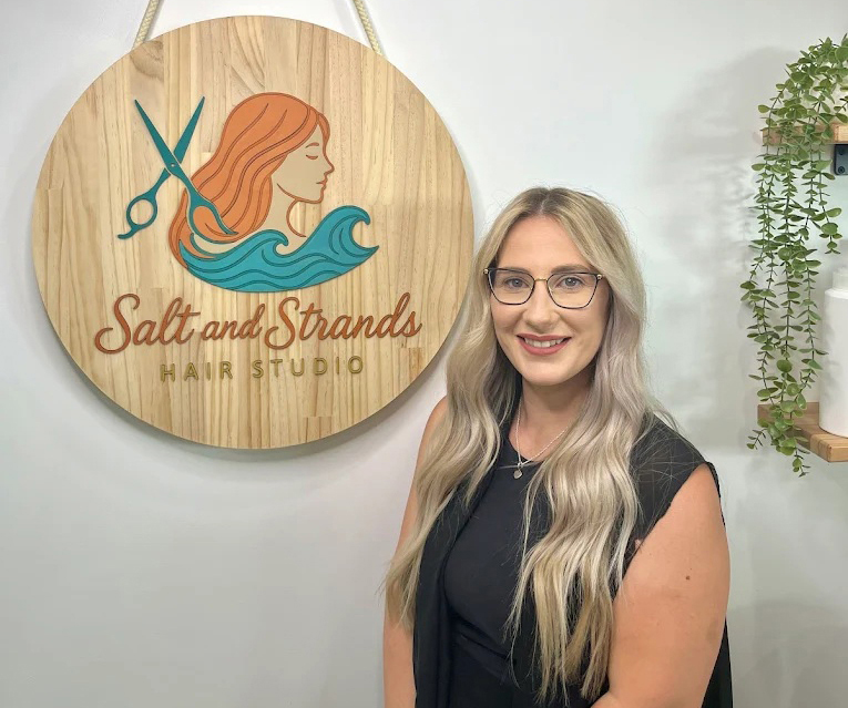Stylist standing inside Salt and Strands Hair Studio